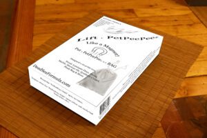 Lift T PetPeePee box on a wood table